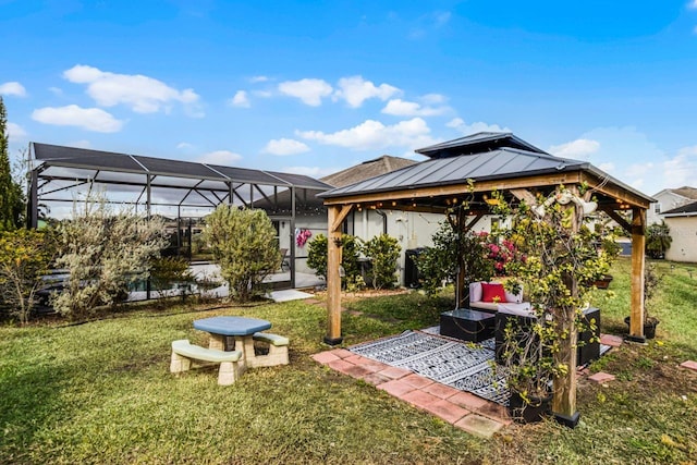 view of yard featuring a gazebo and glass enclosure