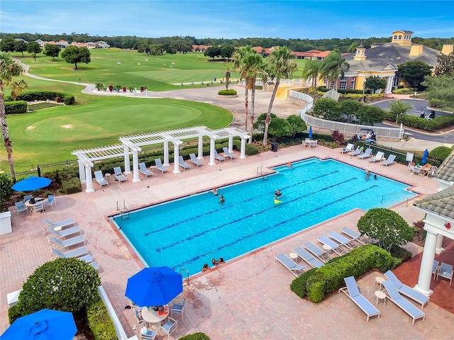 view of swimming pool featuring a pergola