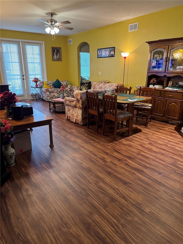 dining area featuring ceiling fan and dark hardwood / wood-style flooring