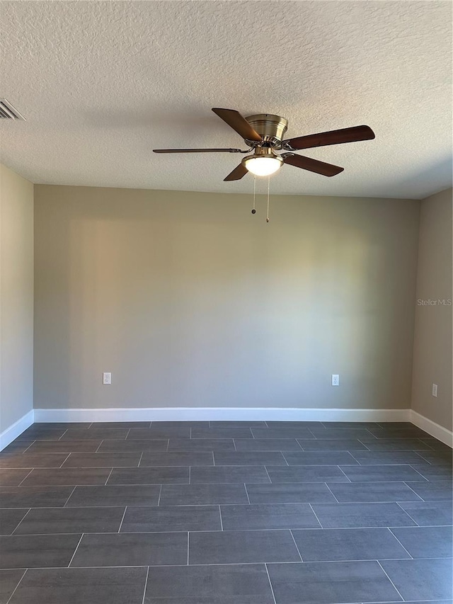 unfurnished room featuring ceiling fan