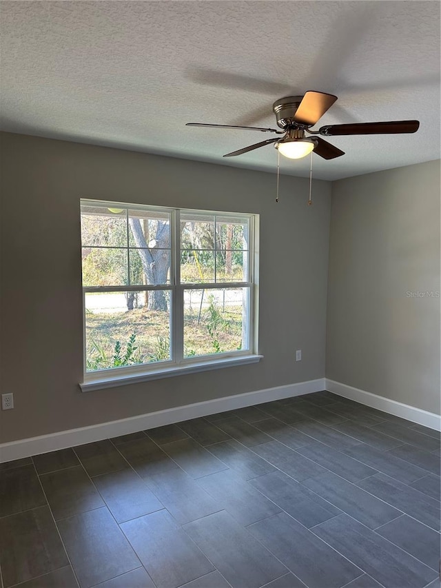 empty room featuring a textured ceiling