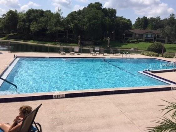 view of swimming pool featuring a patio