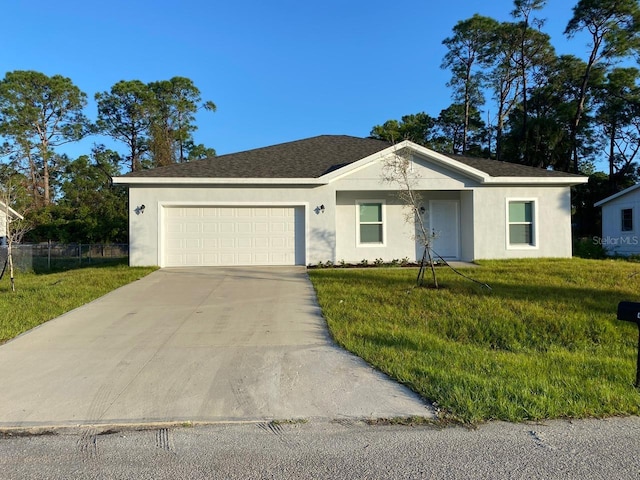 single story home featuring a front yard and a garage