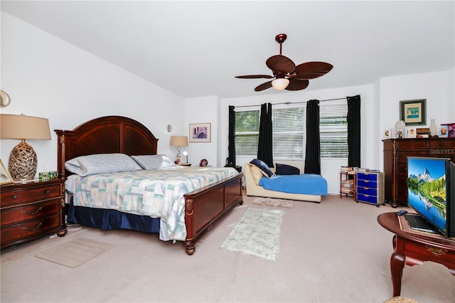 bedroom featuring ceiling fan and light carpet