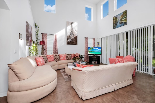 living room featuring a towering ceiling