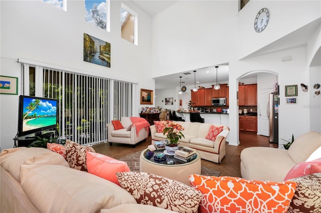 living room with a high ceiling