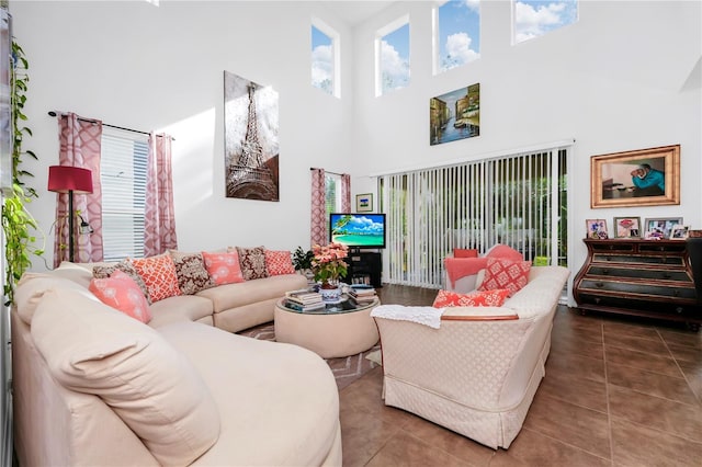 tiled living room with high vaulted ceiling