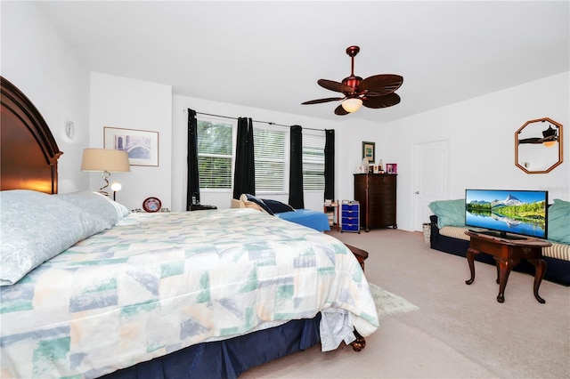 bedroom with light carpet and ceiling fan