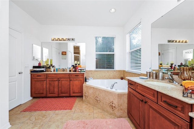 bathroom with tile patterned floors, vanity, and independent shower and bath