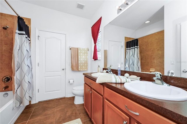 full bathroom with toilet, vanity, tile patterned floors, and shower / bath combo with shower curtain