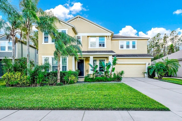 view of front facade with a front yard and a garage