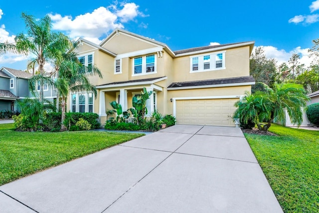 view of front of property with a front yard and a garage