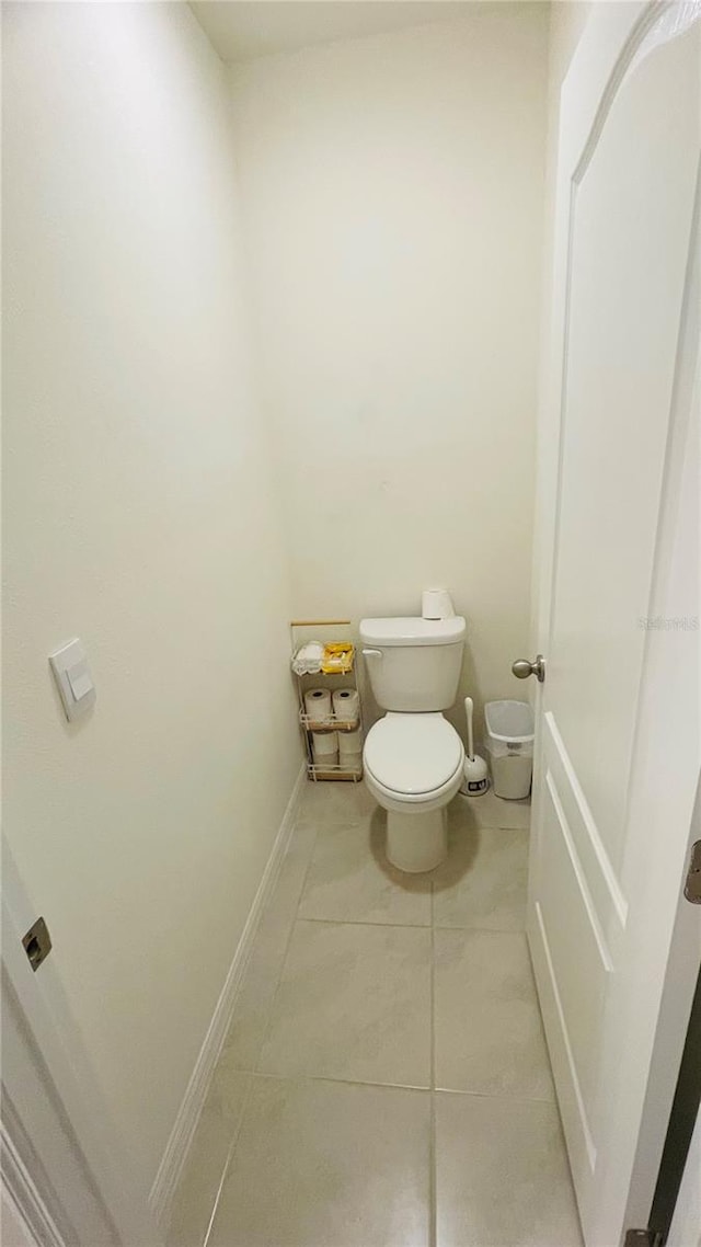 bathroom with tile patterned floors and toilet