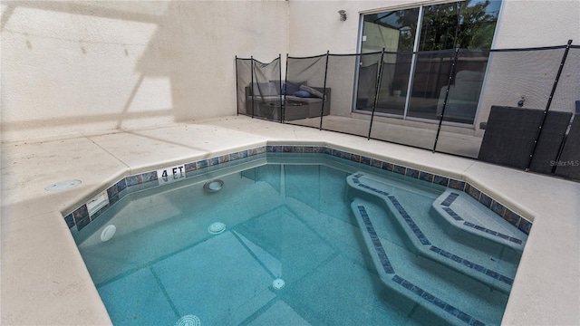 view of pool with a trampoline