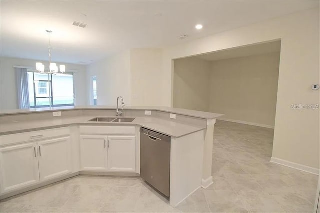 kitchen featuring a notable chandelier, white cabinets, sink, stainless steel dishwasher, and decorative light fixtures