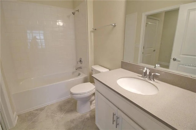 full bathroom with tile patterned floors, tiled shower / bath combo, toilet, and vanity