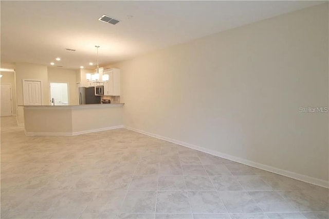 interior space with sink and an inviting chandelier