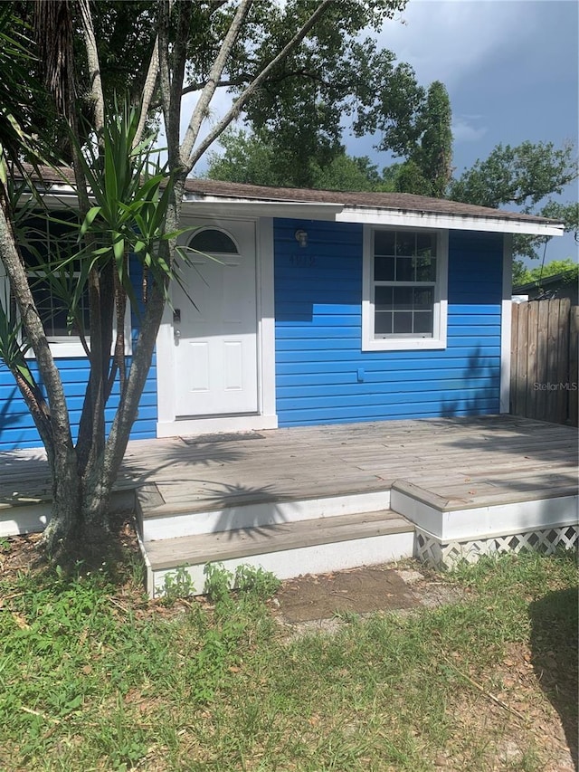 view of outbuilding with fence