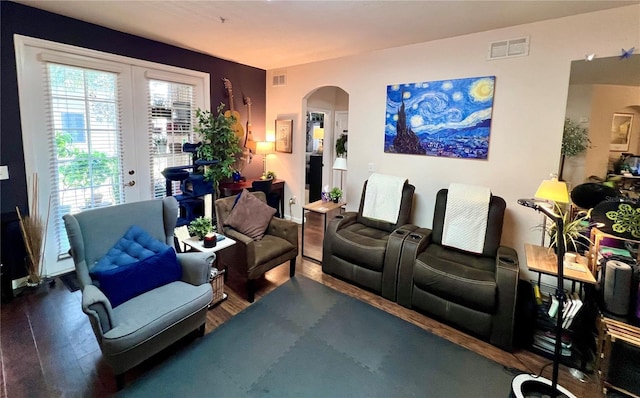 living room with hardwood / wood-style floors and french doors