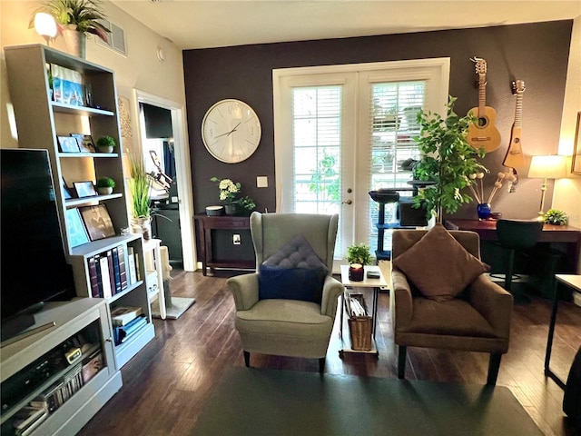 living area featuring dark hardwood / wood-style flooring and french doors