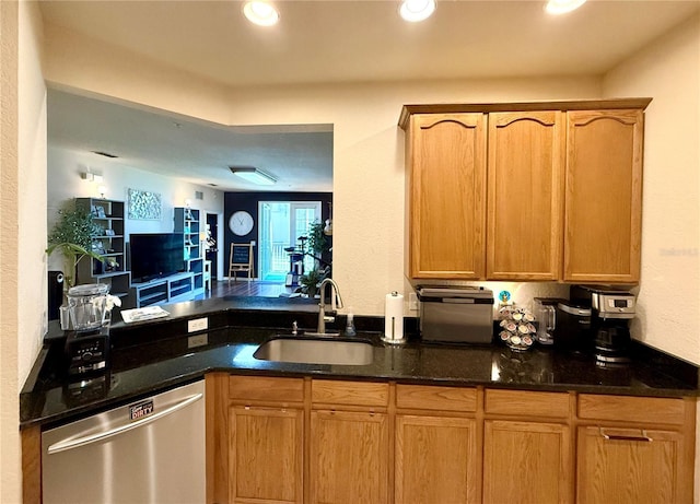 kitchen with recessed lighting, a sink, dark stone counters, dishwasher, and a peninsula