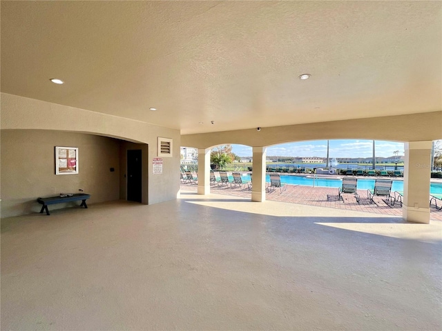 interior space featuring a community pool