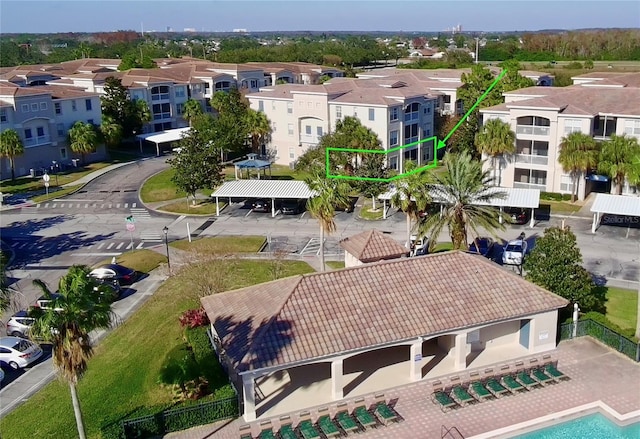 birds eye view of property with a residential view