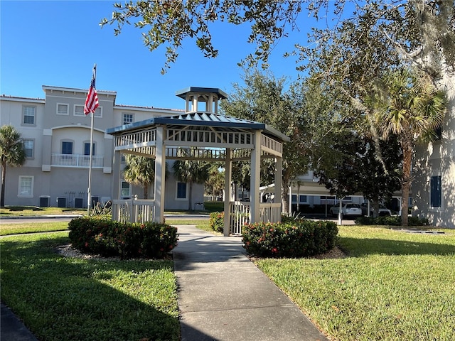 view of property's community with a yard and a gazebo