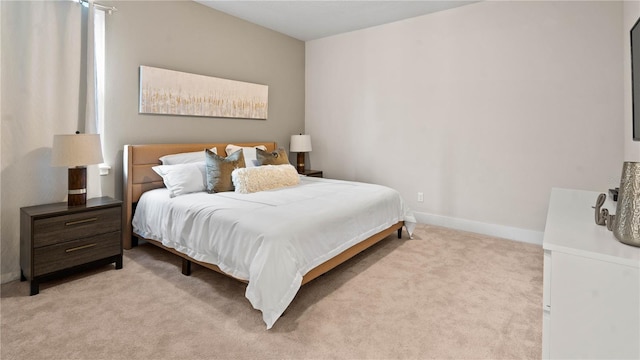 bedroom featuring light carpet