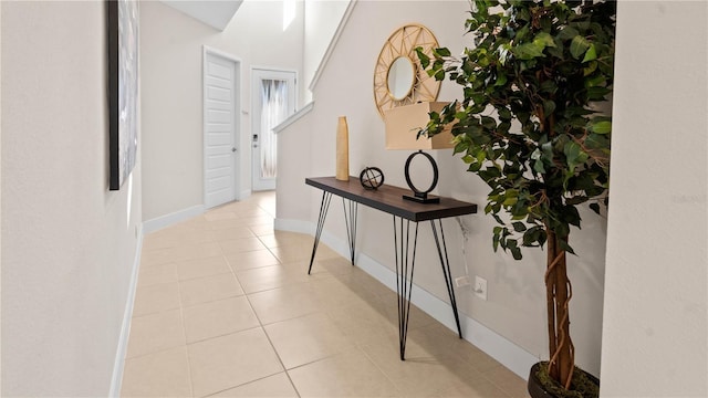 hallway with light tile patterned flooring