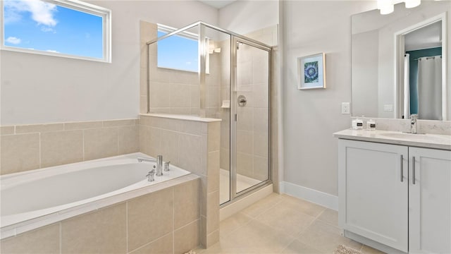 bathroom featuring tile patterned flooring, vanity, and independent shower and bath