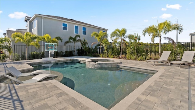 view of pool featuring an in ground hot tub and a patio