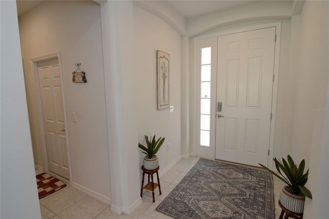 entryway featuring light tile patterned floors