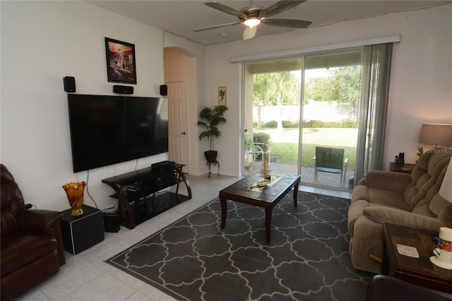 tiled living room with ceiling fan