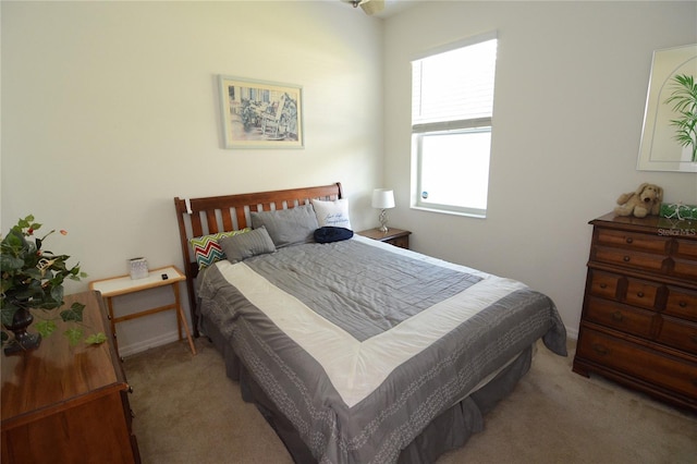 bedroom featuring light carpet