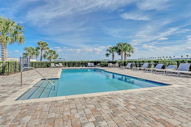 view of swimming pool featuring a patio area