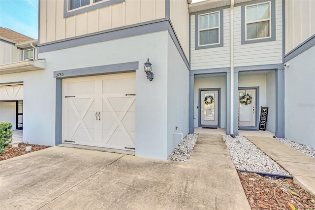 view of exterior entry featuring a garage