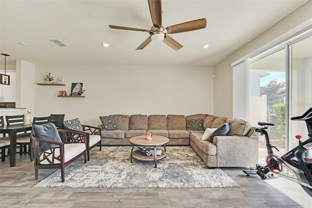 living room featuring ceiling fan