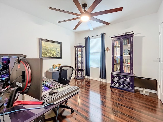 office space featuring dark hardwood / wood-style floors and ceiling fan