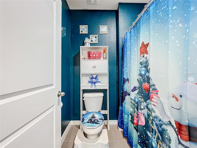 bathroom featuring tile patterned floors and toilet