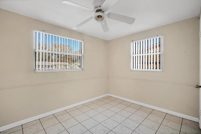 tiled empty room with ceiling fan