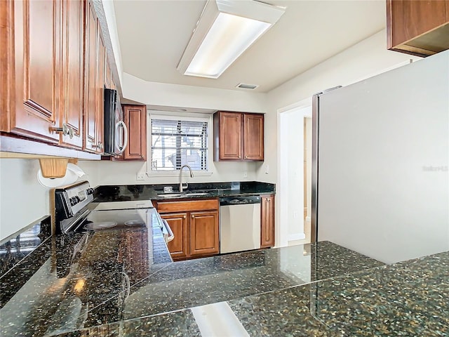 kitchen with sink and appliances with stainless steel finishes