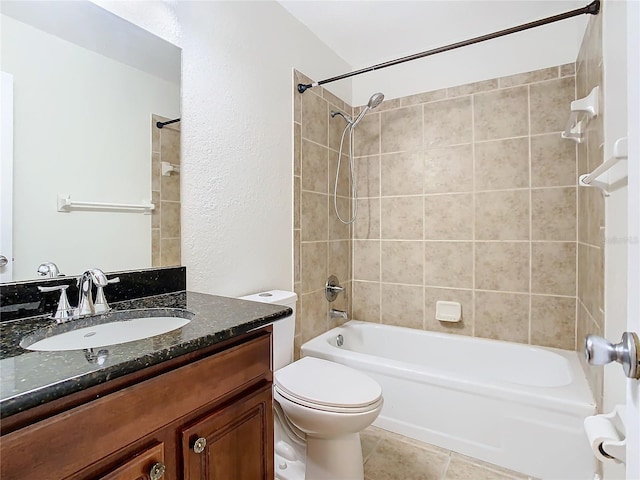 full bathroom with vanity, toilet, and tiled shower / bath