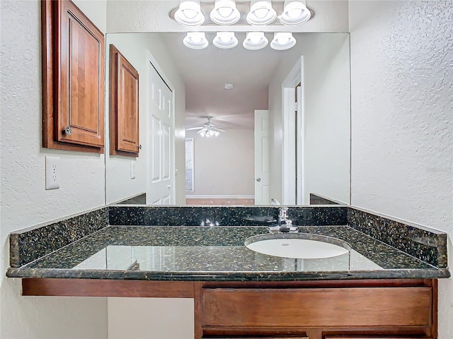 bathroom with vanity and ceiling fan