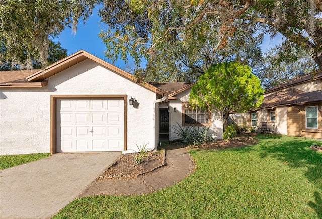 ranch-style house featuring a front yard and a garage