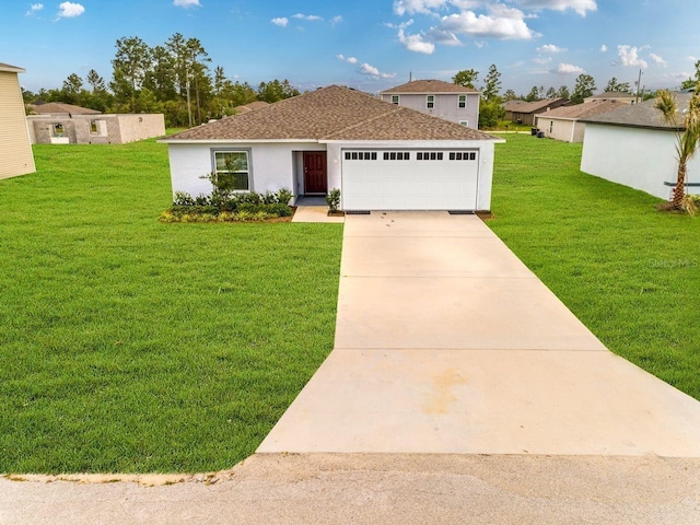 view of front of home featuring a garage and a front lawn