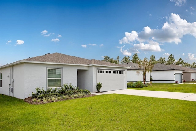 single story home featuring a front lawn and a garage