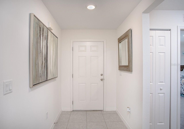 hallway with light tile patterned floors