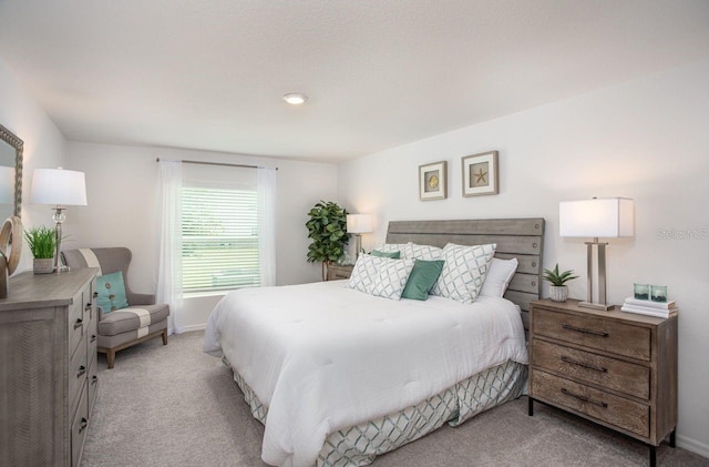 bedroom with light carpet