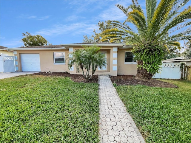 view of front of property with a front yard and a garage